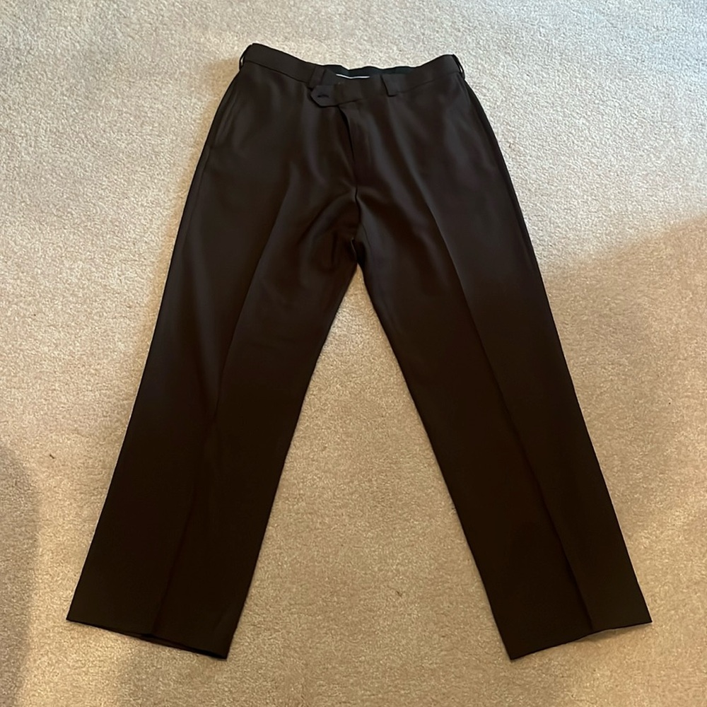 Men’s Haggar Classic Fit brown dress pants with expandable waist.